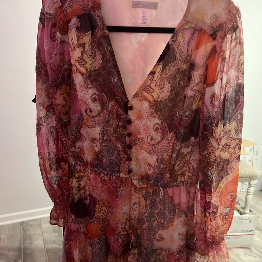Item is NWOT. Beautiful . Picture does not do this dress justice .